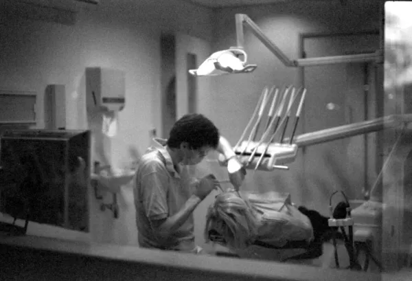 dentist inspecting patients mouth