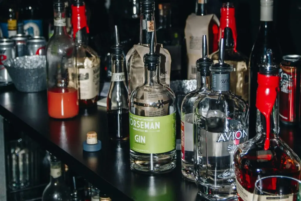drugs and alcohol disability claim, image of alcohol bottles